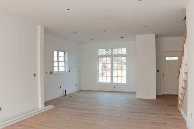 brand-new-house-construction-interior-room-with-unfinished-wood-floors-the-hvac-electr-SBI-301040476.jpg
